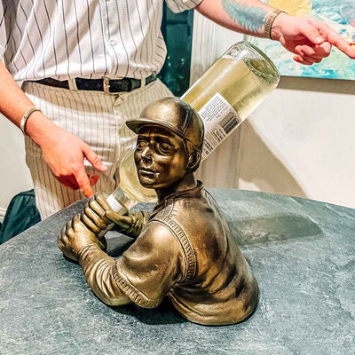 BRONZE BASEBALL PLAYER WINE BOTTLE HOLDER